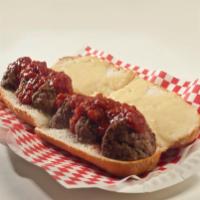 Meatball Parmigiana Hero · Our fresh Italian hero roll stuffed with meatballs, blanketed with mozzarella cheese, baked ...