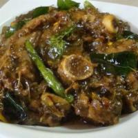 Gongura Mutton Curry · 1 of the best traditional goat dishes cooked with fresh gongura sauce, tadka with mustard, a...