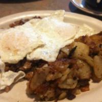 Corned Beef Hash  · Served with potatoes and toast.