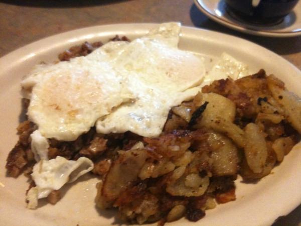 Corned Beef Hash  · Served with potatoes and toast.