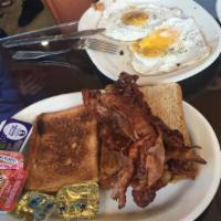 French Toast Combo · 2 eggs and choice of bacon, ham or sausage.