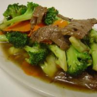 Beef and Broccoli · Marinated beef tenderloin stir fried with broccoli, carrots, ginger and garlic in a light br...