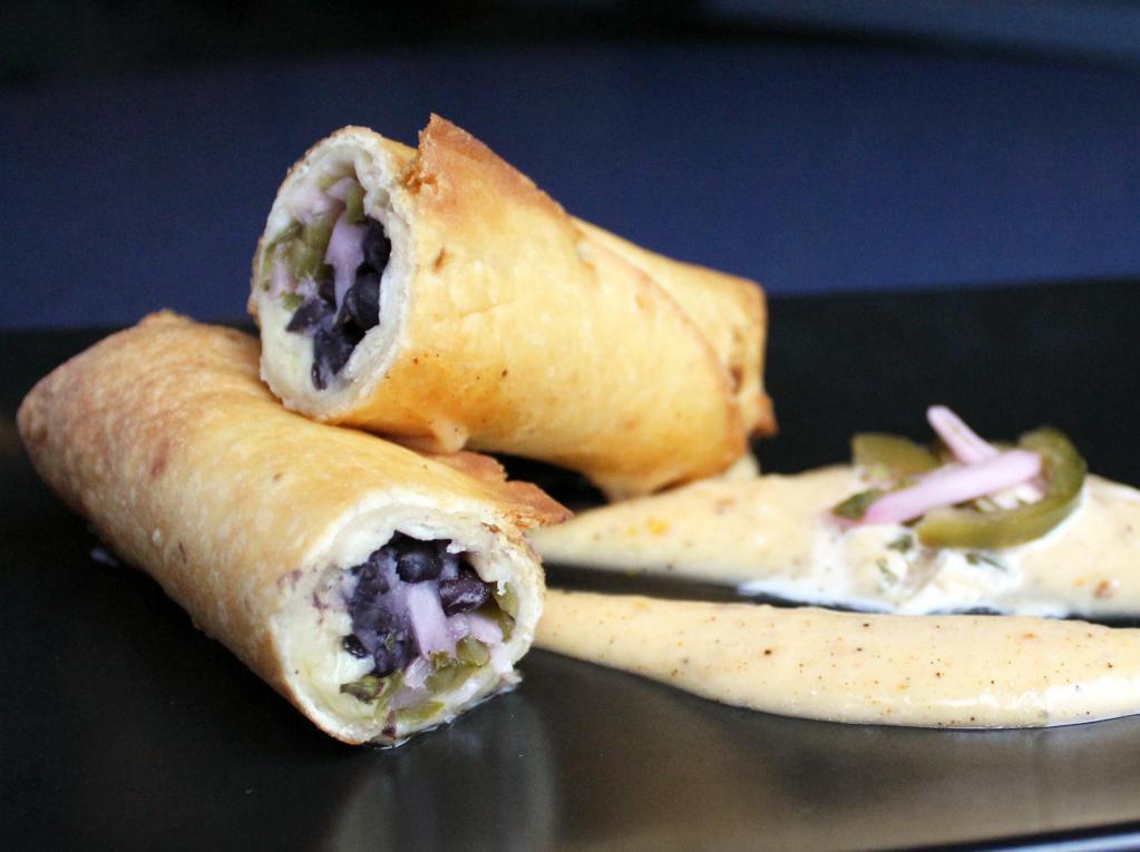 Black Bean-Cheddar Chimichangas (Vegetarian) · Slow-cooked black beans, aged cheddar, pickled red onions and jalepenos, cilantro, lime chili aeoli