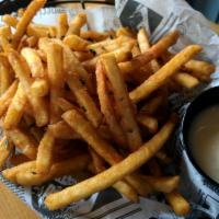 Rosemary Truffle Fries (V, GF) · Salt and pepper seasoned fries tossed in truffle oil topped with fresh rosemary and served w...