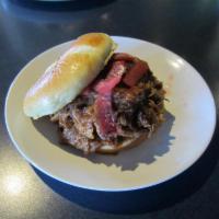 BBQ Pulled Pork · Slow-roasted pulled pork glazed with tangy BBQ sauce topped with pickled onions and peppers ...