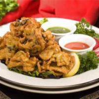 Mixed Vegetable Pakora · Mixed vegetable fritters battered with chick peas flour.