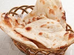 Naan · Leavened traditional white bread baked in the clay oven.