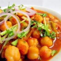 Channa Masala · Chickpeas cooked with fresh tomatoes and tangy spices. Served with rice.
