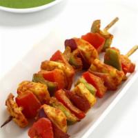 Paneer Tikka · Tender cubes of homemade cheese marinated in fresh spices, roasted in the clay oven. Served ...