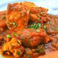 Chicken Vindaloo · Tender cubes of chicken with potatoes cooked on a flery hot curry sauce. Served with rice.