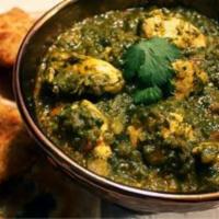 Chicken Saag · Tender cubes of chicken cooked with curry spices and spinach. Served with rice.