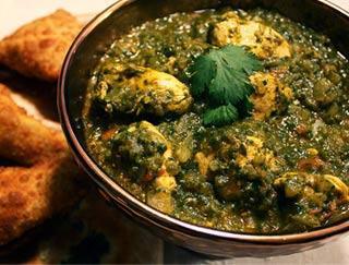 Chicken Saag · Tender cubes of chicken cooked with curry spices and spinach. Served with rice.