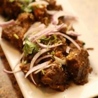 Goat Sukha · Bone in. Tender chunks of goat meat, cooked with a variety of spices and herbs and pan roast...