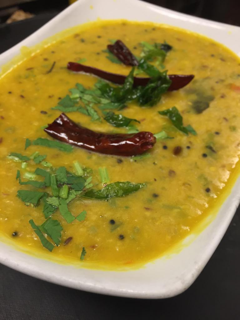 Dal Tadka · A classic dish, widely enjoyed across india either eaten with roti or steamed rice. Lentil stew simmered in simple spices and tempered with mustard seeds, dry chilli and curry leaves. Vegetarian.