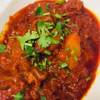 Lamb Vindaloo · A goan specialty, originally adapted from the Portuguese, tender pieces of lamb cooked in a ...