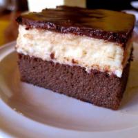 Ledena Kocka · Layer of moist chocolate cake topped with custard and chocolate.