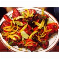 Tandoori Hot Wings · Hot chicken wings marinated with spices and roasted in a tandoor.