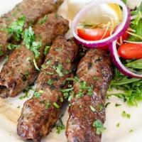 Seekh Kabab · Minced lamb cooked on skewers with herbs and spices.