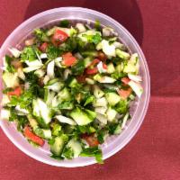 Shirazi / Persian Salad · Traditional Persian salad made with chopped tomatoes, cucumbers, onions, and fresh parsley s...