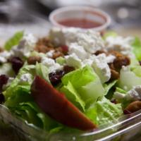 Apple Cranberry Walnut Salad · Lettuce, dried cranberries, apple, goat cheese and caramelized walnuts.
