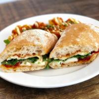 Spanish Grilled Cheese Sandwich v · tronchon cheese, roasted tomato, arugula and tomato jam