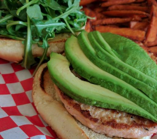 Salmon Burger · Grilled served with arugula, avocado and caper aioli.