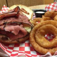 The Warriors Burger · Topped with pastrami, Swiss cheese, grilled onions and our homemade sauce with onion rings.