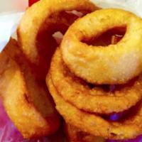 Beer Battered Onion Rings · Sliced white onions, beer-battered and deep fried.