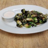 Charred Brussels Sprouts · Wood-fired Brussels sprouts, onions and garlic with a balsamic drizzle and garlic aioli.