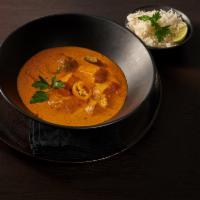 Chicken Tikki Masala · Tandoori chunks of chicken cooked with onion and bell pepper in a to tomato sauce. Served wi...