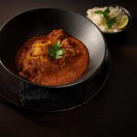 Goat Curry · Tender cubes of goat with bone, cooked on slow heat with herbs and spices. Served with basma...
