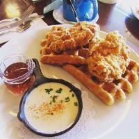 Chicken and Waffles · Liege waffles, buttermilk boneless fried chicken breasts, lemon Parmesan cream sauce, and pu...