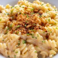Mac and Cheese Lunch · Fusilli pasta tossed with garlic, herbs, cream, jack, cheddar and Parmesan cheese. Topped wi...