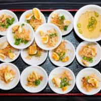 A5. Banh Beo Chen · 12 steamed rice cakes topped with ground shrimp, green onions ,fried shallot and fried pork ...