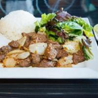 C1. Com Bo Luc Lac (Wok-Seared Cubed Filet Mignon) · Wok-seared cubed filet mignon, onions and bell peppers served with steamed rice, mixed green...
