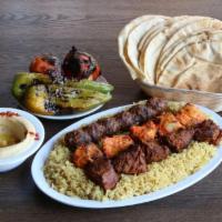 Family Mini Meal · 1 chicken, 1 lamb, 1 beef kebab skewers served over rice pilaf with grilled vegetables.Your ...