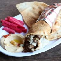 Beef Shawarma Wrap · Lettuce, tomatoes, onions & tahini served with pickled turnips & a side pick.