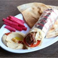 Lule Kebab Wrap · Tomatoes & seasoned onions served with pickled turnips & a side pick.