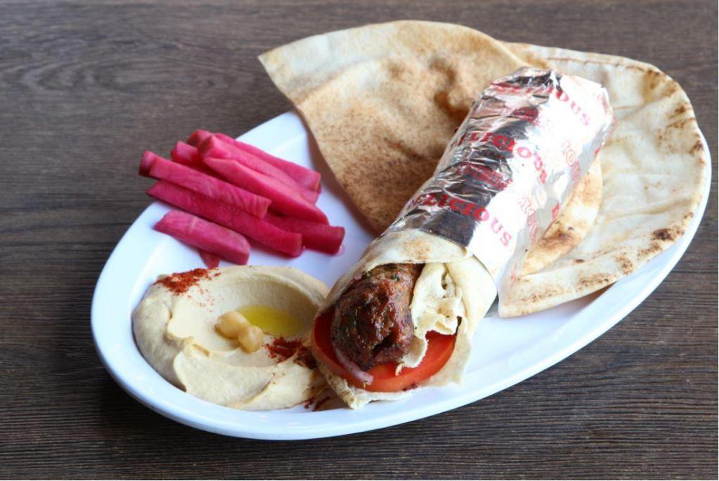 Lule Kebab Wrap · Tomatoes & seasoned onions served with pickled turnips & a side pick.
