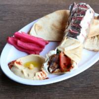Lamb Kebab Wrap · Lettuce, tomatoes & tzatziki served with pickled turnips & a side pick.