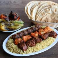 Kebab Combo · One each chicken, beef & lule skewers, over rice pilaf & grilled vegetables.