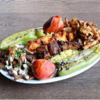 Kebab & Shawerma Combo · One each chicken kebab, beef kebab, chicken shawerma, beef shawerma over rice pilaf & grille...