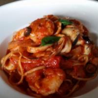 Seafood Tomato Pasta · Shrimp, calamari, clam, and mussels in a homemade tomato sauce.