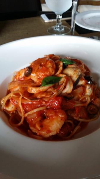 Seafood Tomato Pasta · Shrimp, calamari, clam, and mussels in a homemade tomato sauce.