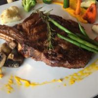22 oz. Cowboy Steak · Bone in ribeye, perfectly marbled and cooked to perfection. Served with amuse bouche, bread,...