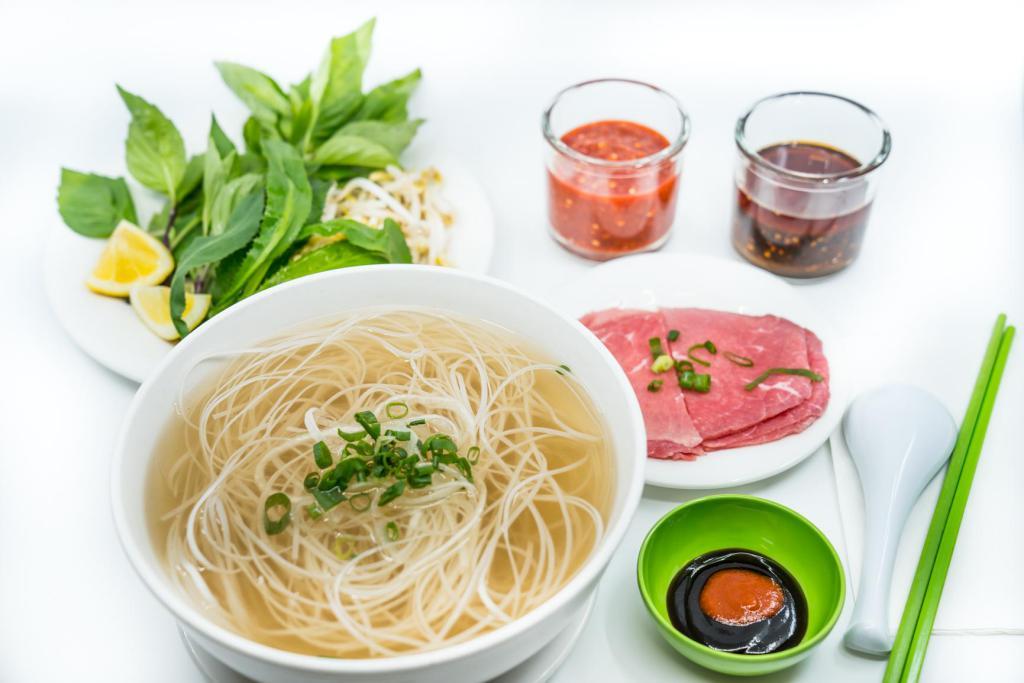 2. Large Steak Pho Noodle Soup · Vietnamese pho noodle soup served with steak rice noodle, garnished with green and white onion.