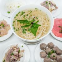 10. Large Pho Noodle Soup · Vietnamese pho noodle soup served with your choice of three items - rice noodle, garnished w...