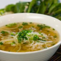 11. Large Plain Pho Noodle Soup · Vietnamese pho noodle soup served with rice noodle, garnished with green and white onion.