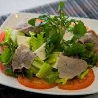 21. Watercress Salad · Watercress, lettuce, sauteed beef, tofu and fresh tomatoes in house made vinaigrette dressing.