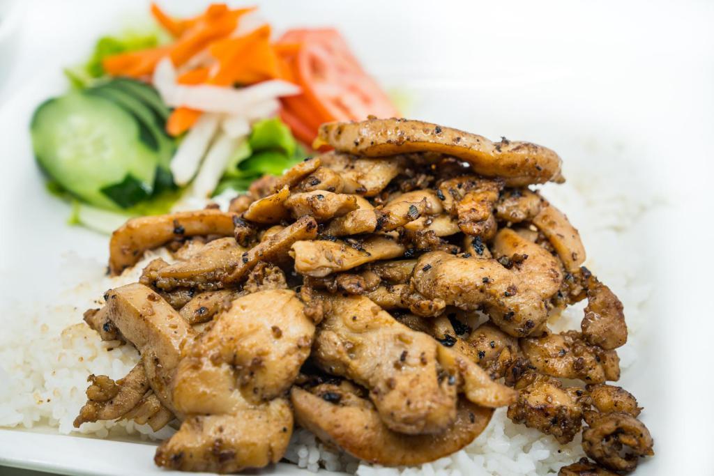 Lemongrass Chicken Rice Plate · Rice plates (com phan) includes steamed white jasmine or brown rice and tossed salad.